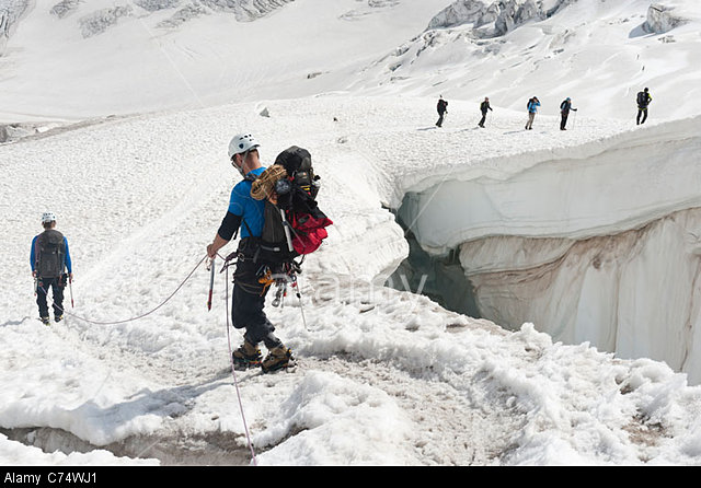 Climbers walking among crevasses on the Vallee Blanche glacier in Chamonix, France